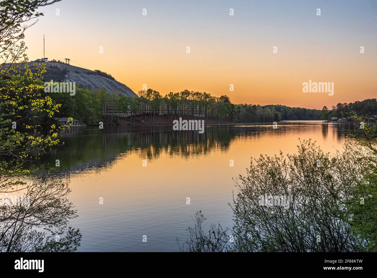 Sunset view of the Atlanta Evergreen Lakeside Resort and Stone Mountain Park Campground lakefront yurts at Stone Mountain Park in Atlanta, Georgia. Stock Photo