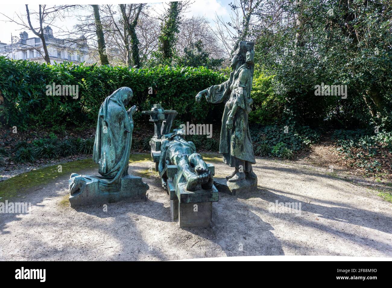 The Victims. A sculpture representing victims of war by Andrew O’Connor in Merrion Square Park, Dublin. The victim is mourned by his wife and mother. Stock Photo