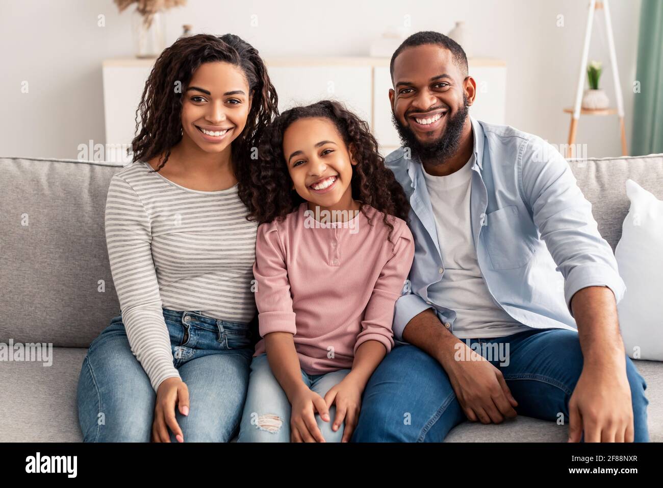 Portrait of a happy black family smiling at home Stock Photo - Alamy