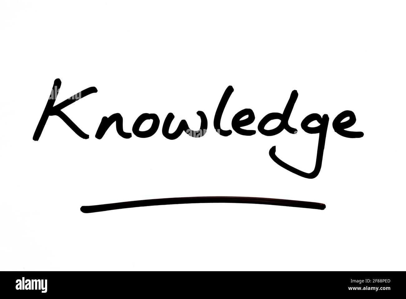 Knowledge, handwritten on a white background. Stock Photo