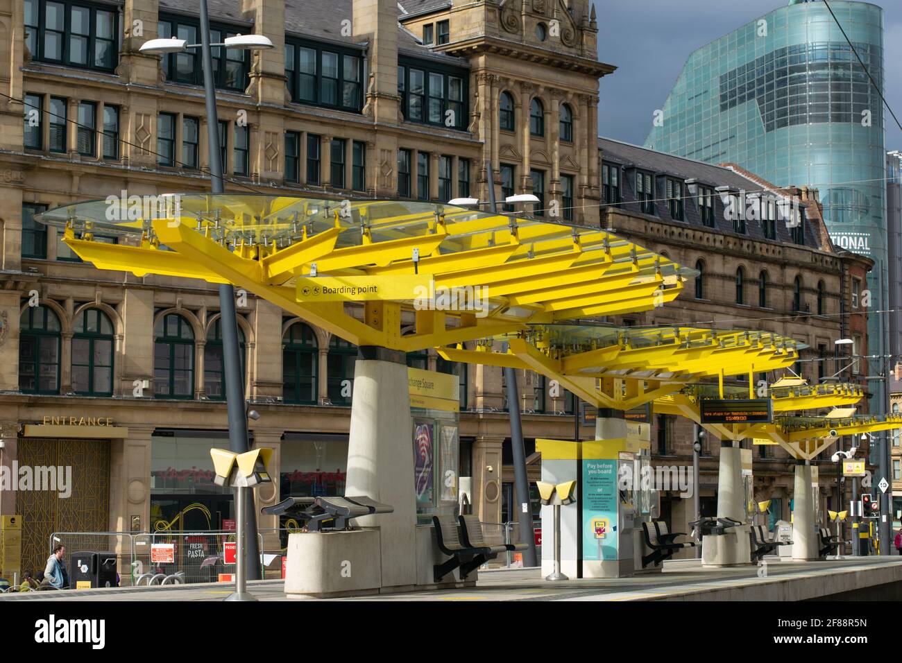 Exchange Square Metrolink tram stop with no people during national lockdown in England. National Museum of Football in background. Stock Photo