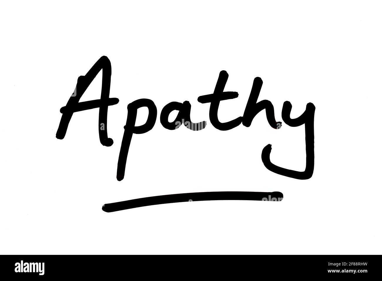 Apathy, handwritten on a white background. Stock Photo