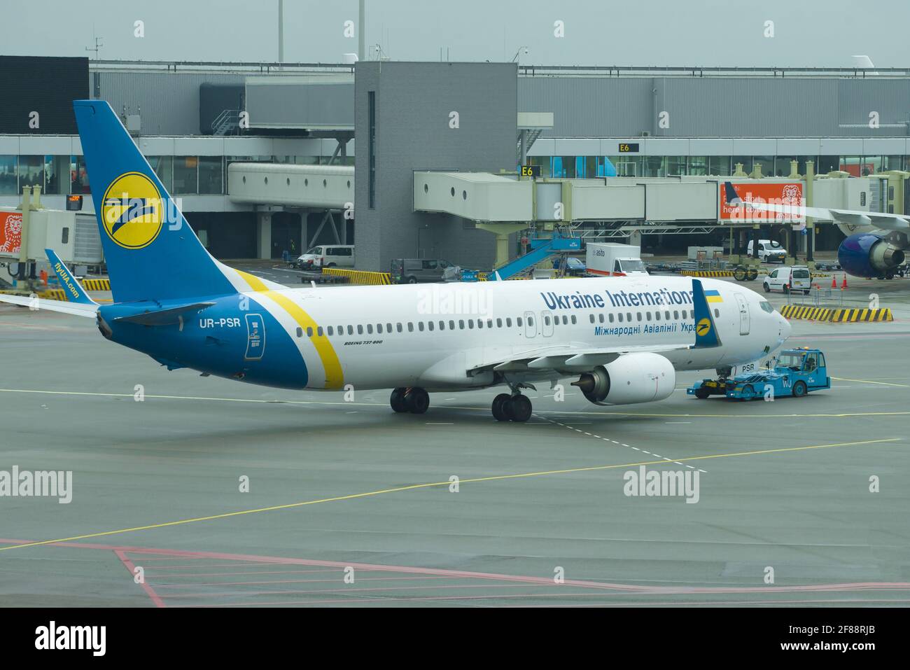 AMSTERDAM, NETHERLANDS - SEPTEMBER 30, 2017: Towing Boeing 737 (UR-PSR) Ukrainian International Airlines on the Schiphol Airport Stock Photo