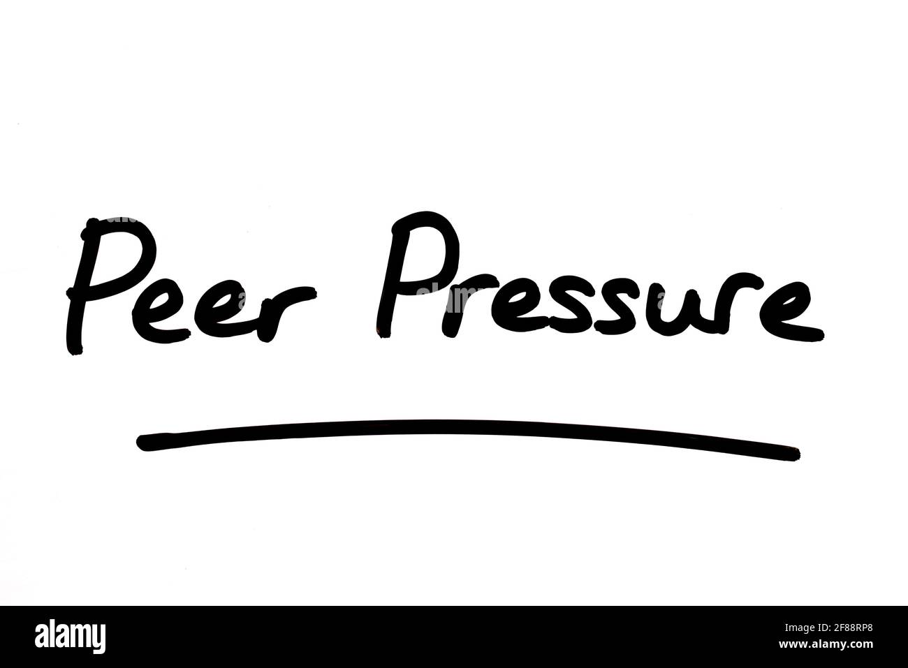 Peer Pressure, handwritten on a white background. Stock Photo