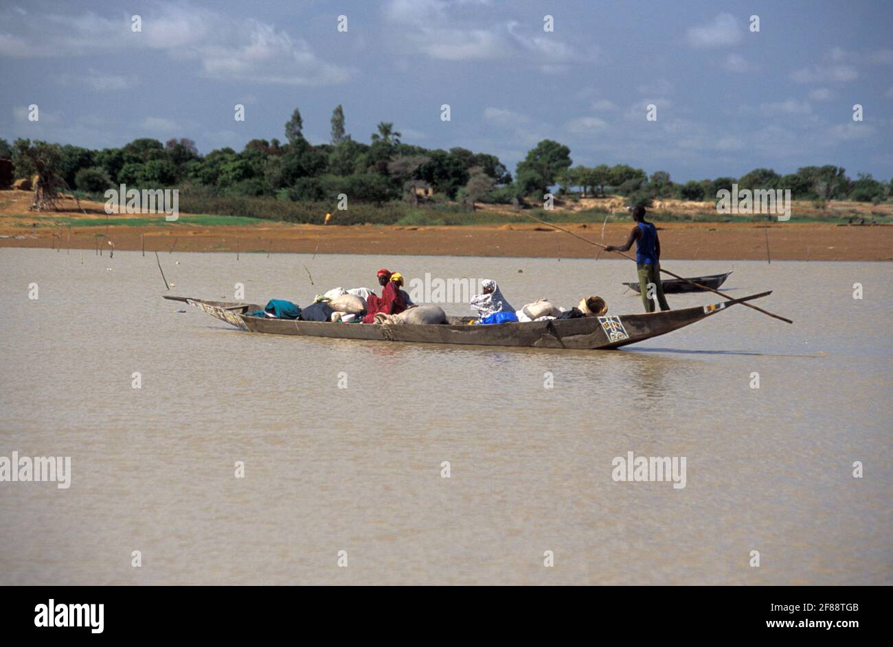 Transporting passengers in a pirogue in Bani river, Mali Stock Photo