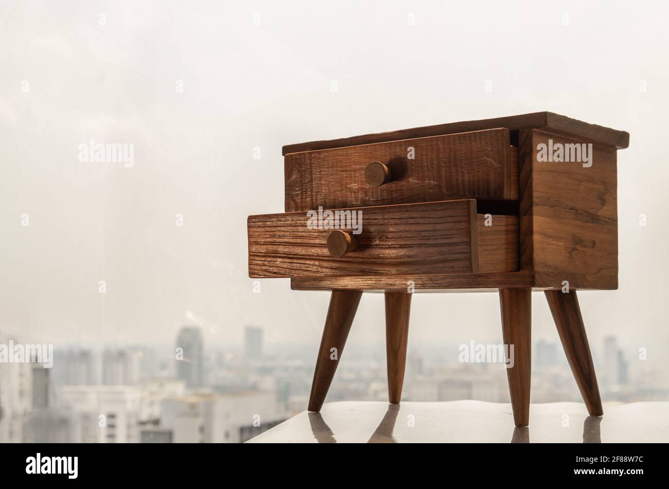 Teak bedside table. Modern designer nightstand, with two