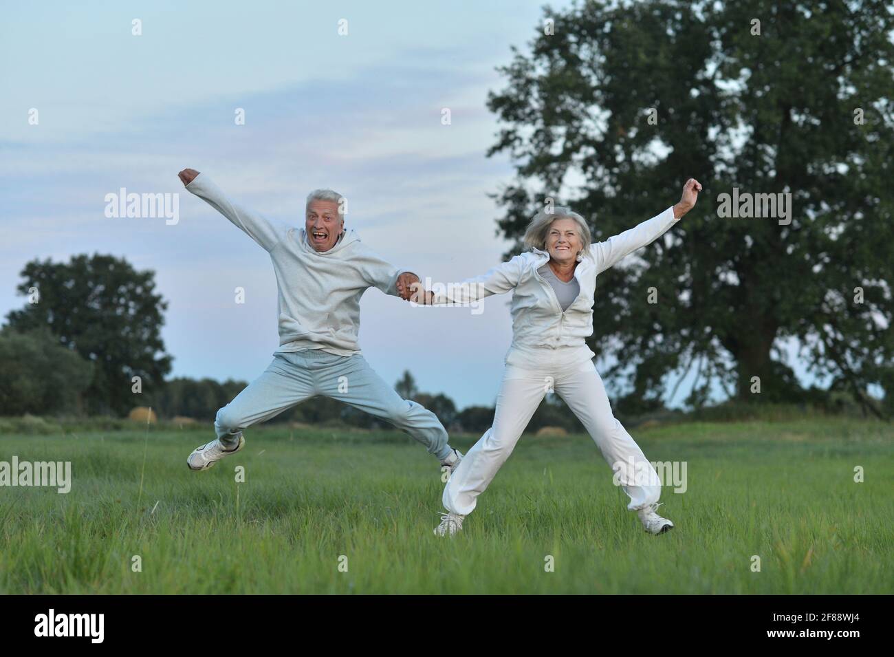 Happy jumping older people hi-res stock photography and images - Alamy