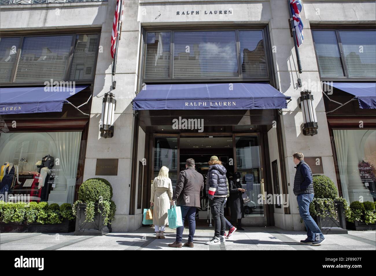 London, UK. 12th Apr, 2021. People Queue outside Polo Ralph Lauren in New Bond  Street. Number of shoppers in central London booms as Covid19 restrictions  are eased. (Photo by Pietro Recchia/SOPA Images/Sipa