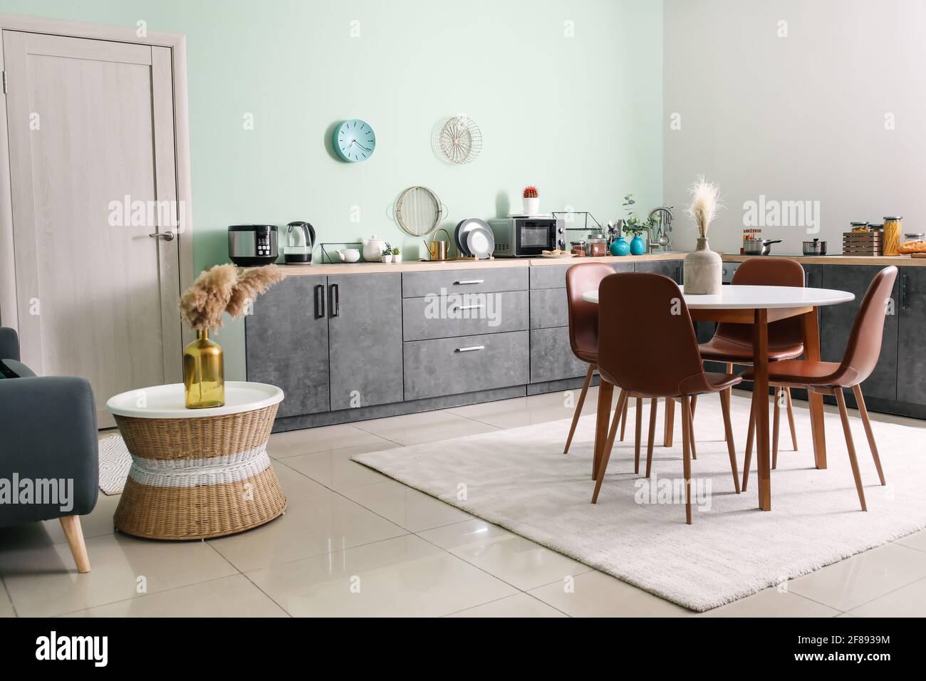 Dining table and chairs in interior of modern kitchen Stock Photo - Alamy