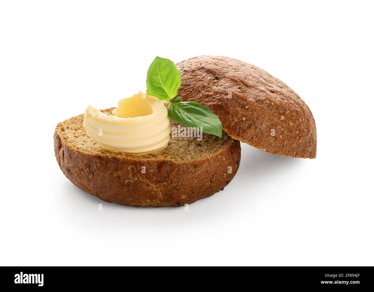 Fresh bread with butter and basil on white background Stock Photo - Alamy