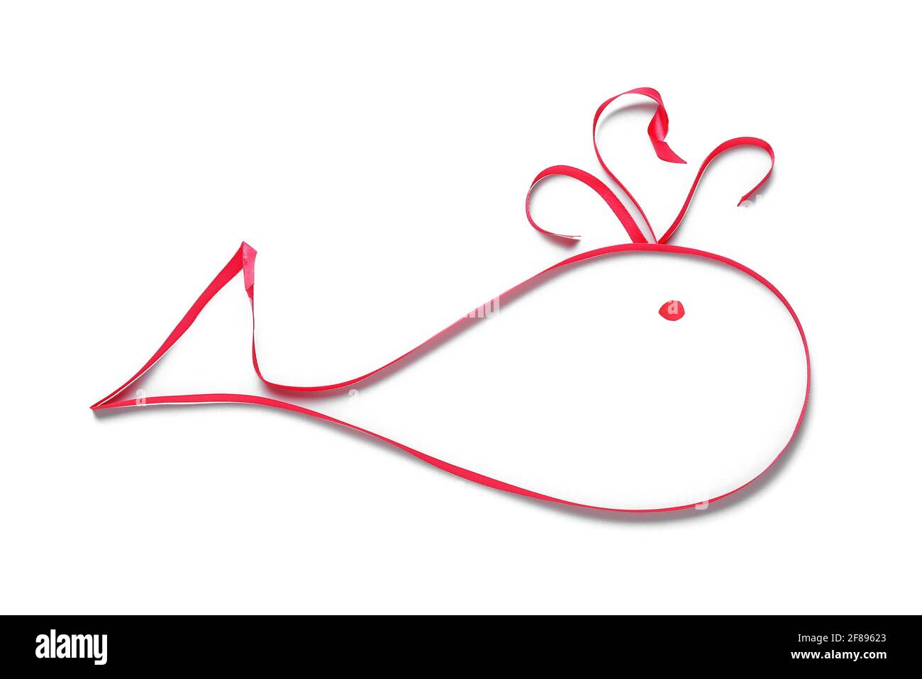 Whale made of red ribbon on white background Stock Photo - Alamy
