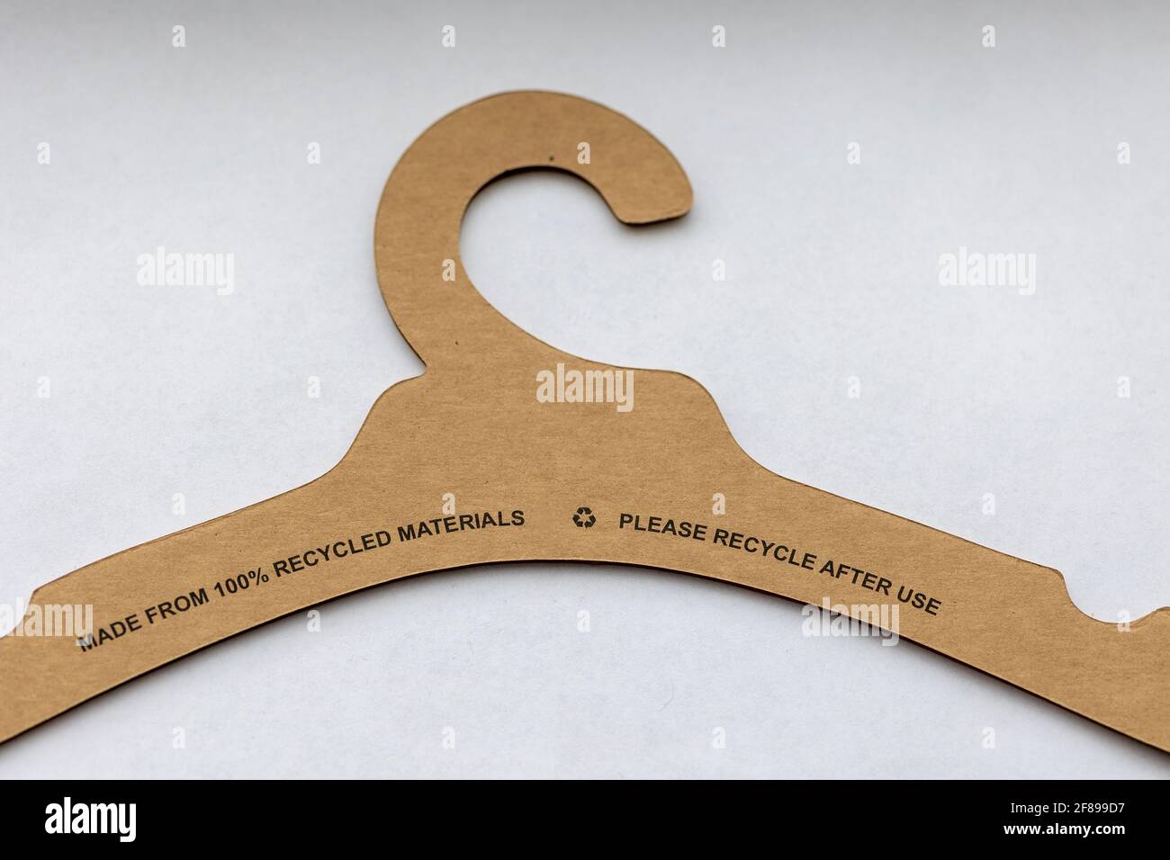 A portrait of a recyclable clothes hanger made of paper and cardboard