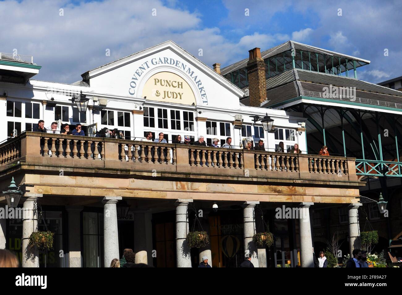 London, UK. 12th Apr, 2021. Punch and Judy pub in Covent garden market  overlooks busker. Lockdown restrictions eased in London West End Credit: JOHNNY ARMSTEAD/Alamy Live News Stock Photo