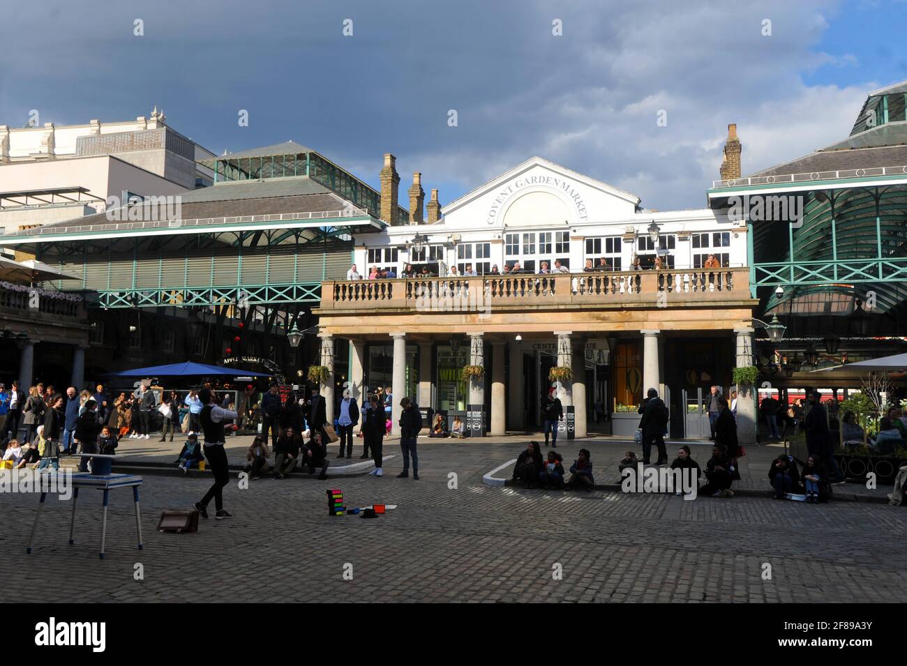 London, UK. 12th Apr, 2021. Punch and Judy pub in Covent garden market  overlooks busker. Lockdown restrictions eased in London West End Credit: JOHNNY ARMSTEAD/Alamy Live News Stock Photo