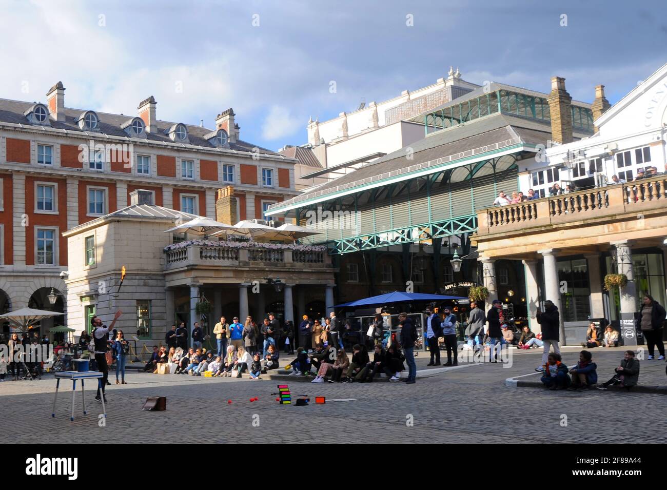 London, UK. 12th Apr, 2021. Punch and Judy pub in Covent garden overlooks busker. Lockdown restrictions eased in London West End Credit: JOHNNY ARMSTEAD/Alamy Live News Stock Photo