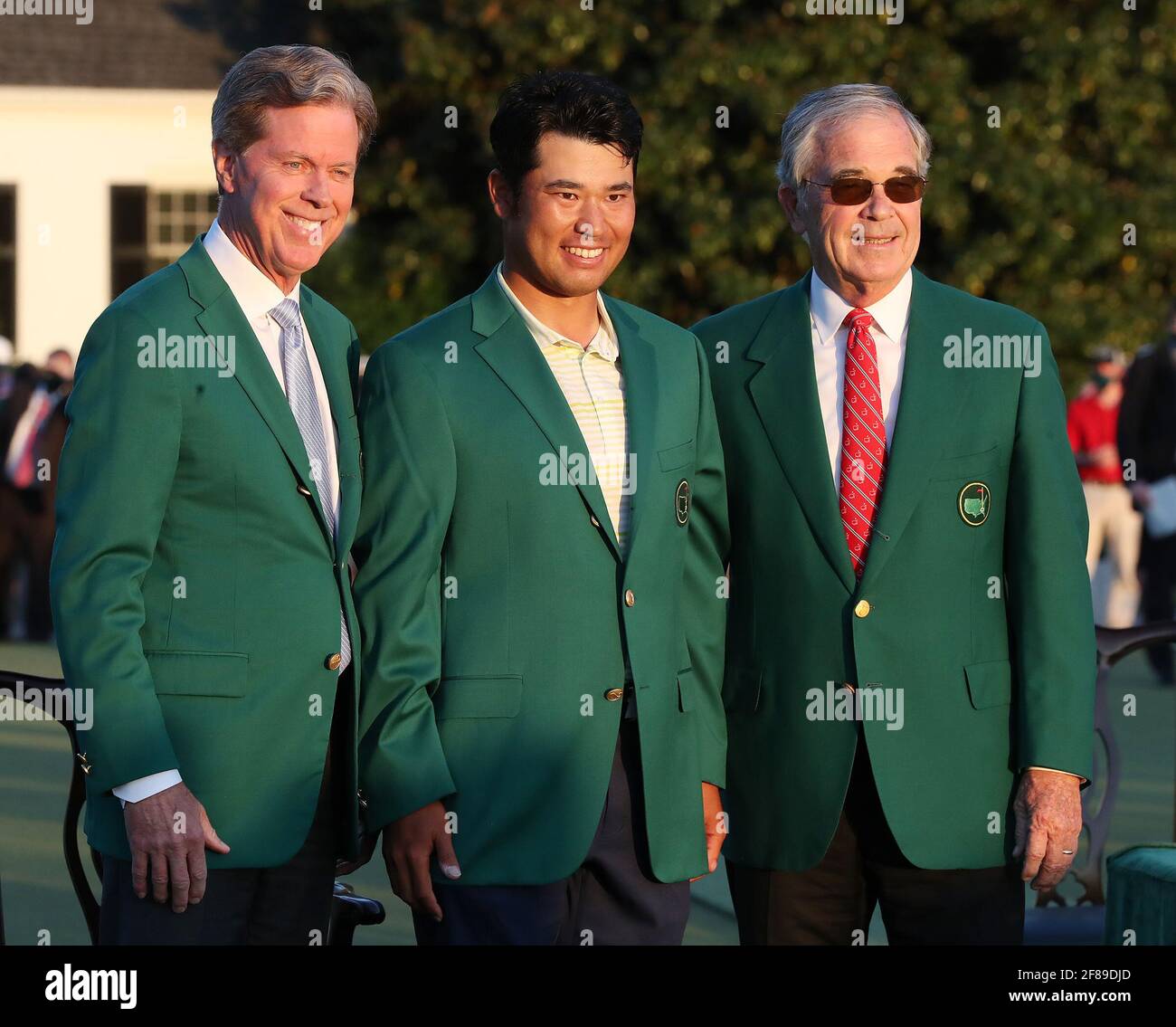 Augusta, USA. 11th Apr, 2021. From left, Chairman Fred Ridley, Hideki Matsuyama and Chairman Emeritus Billy Payne during the green jacket ceremony after Matsuyama won the Masters on Sunday, April 11, 2021, at August National Golf Club in Augusta, Georgia. (Photo by Curtis Compton/Atlanta Journal-Constitution/TNS/Sipa USA) Credit: Sipa USA/Alamy Live News Stock Photo