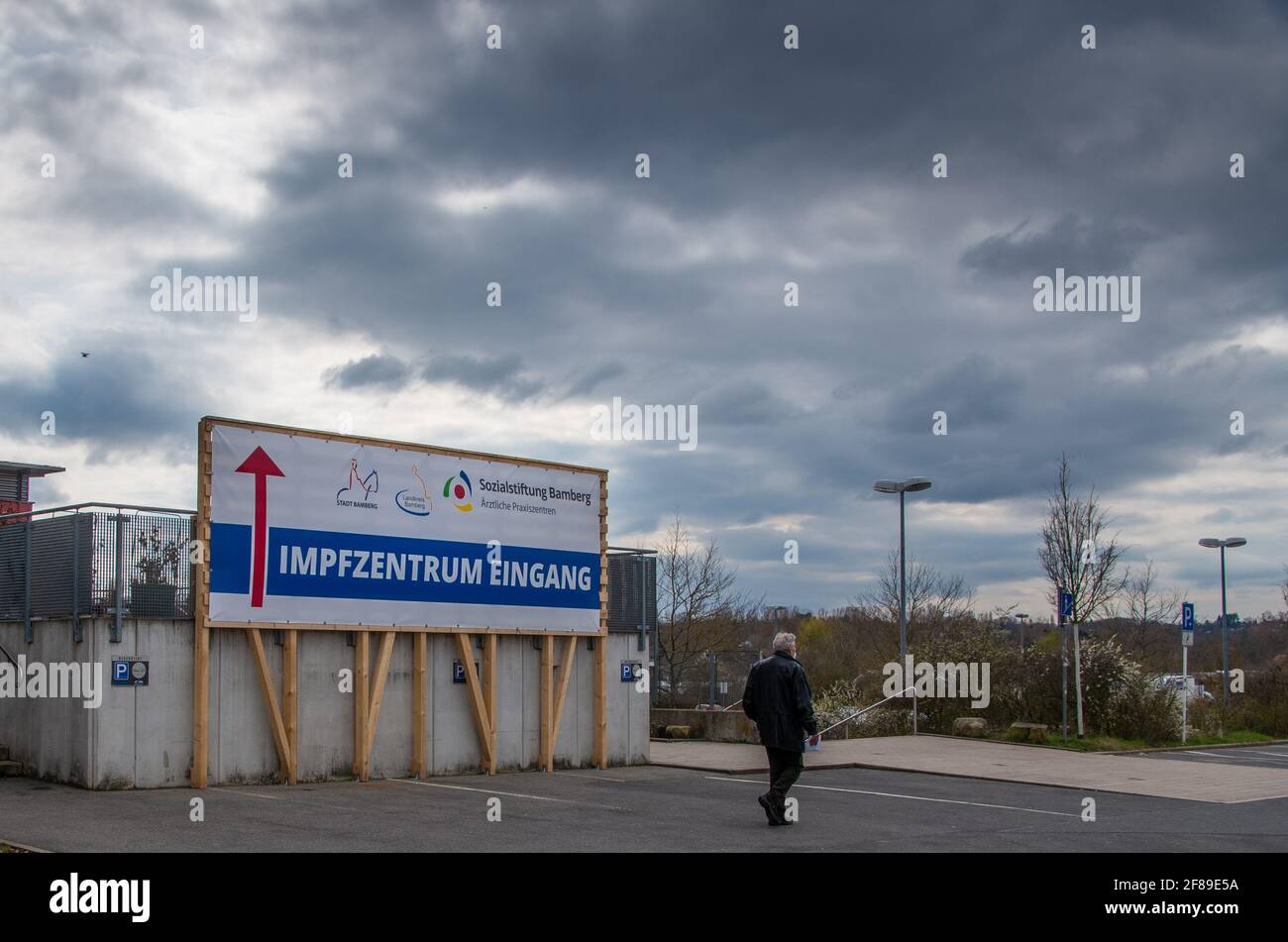 Bamberg, Germany - 10.4.2021. A large sign points the way to the Vaccination Centre of Bamberg. Stock Photo