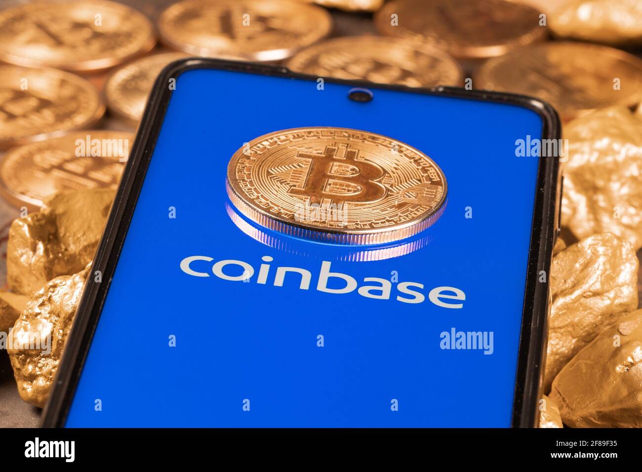Coinbase crypto exchange logo on screen with Bitcoin coins. Ljubljana,  Slovenia - April 12 2021 Stock Photo - Alamy
