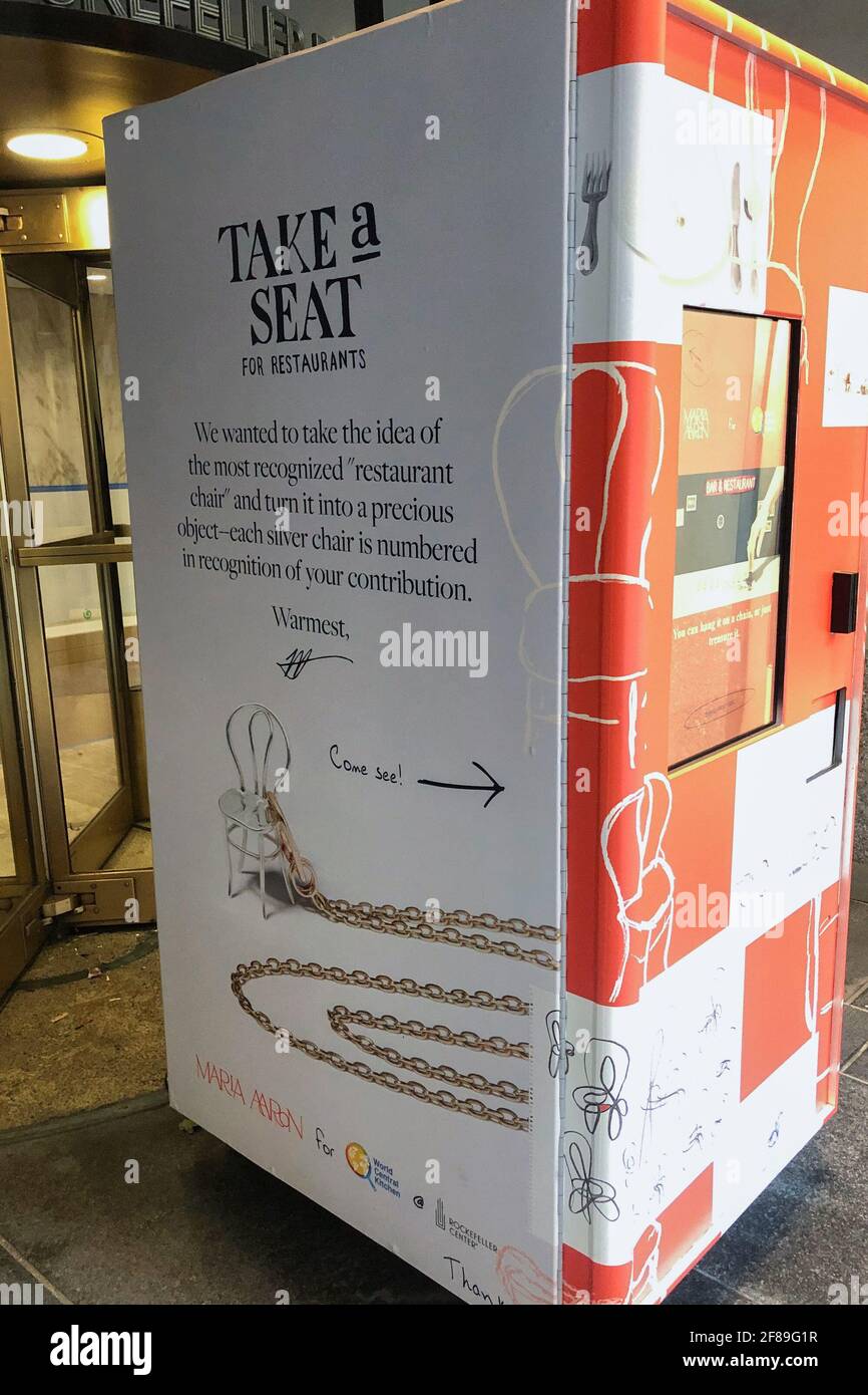 New York, United States. 08th Apr, 2021. A vending machine in Rockefeller Center on April 8, 2021 offers a silver chair designed by artist Marla Aaron to help families in need and the struggling restaurant community. The Chair, made in sterling silver, is 2 inches tall and can be worn on any chain as a necklace, or kept as a figurine. It sells for $250 with 100% of sales proceeds benefit Chef José Andrés' nonprofit World Central Kitchen. (Photo by Samuel Rigelhaupt/Sipa USA) Credit: Sipa USA/Alamy Live News Stock Photo