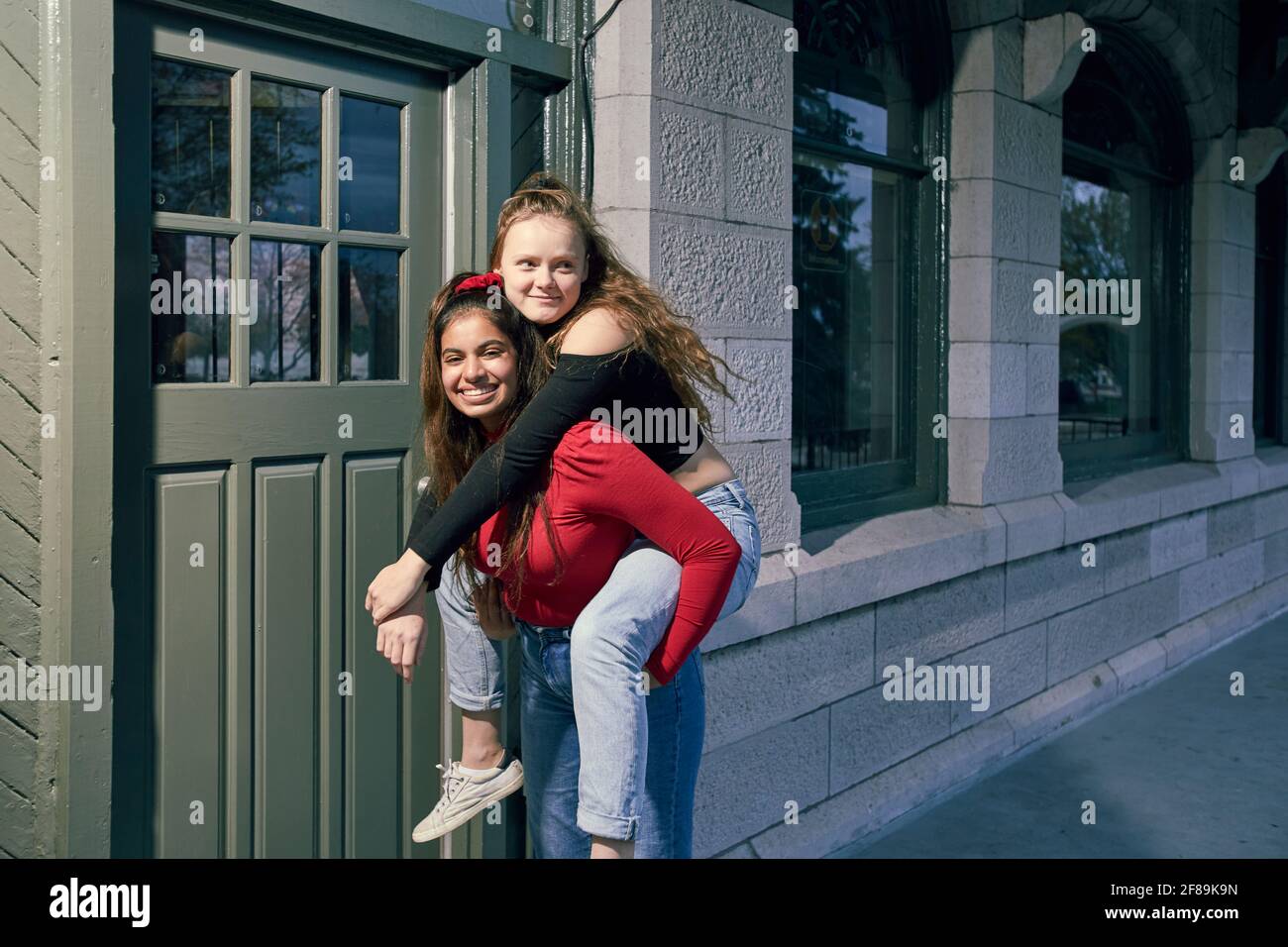 Two girls best friends since kindergarten, reuniting and having a fun evening Stock Photo