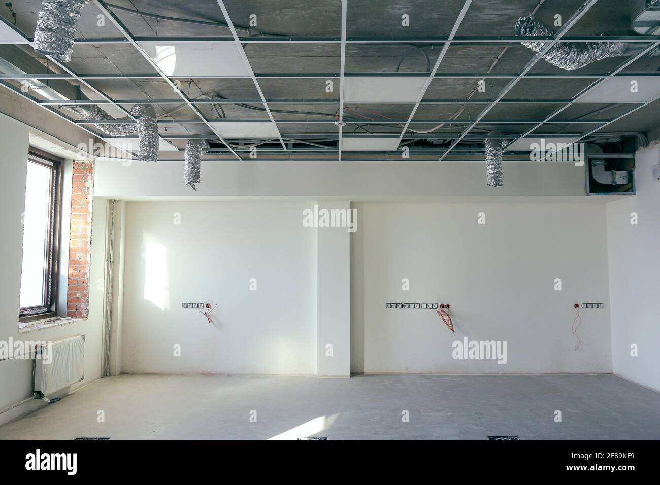 The hanging ceiling in the office under construction. The ceiling false