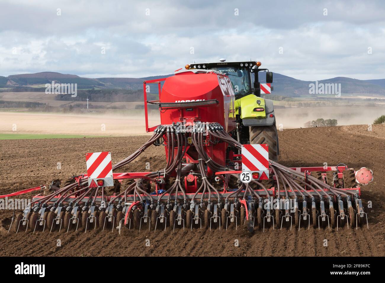 A Detailed Rear View of a Horsch Pronto DC Disc Seed Drill Sowing Seed in a Field in Spring Stock Photo