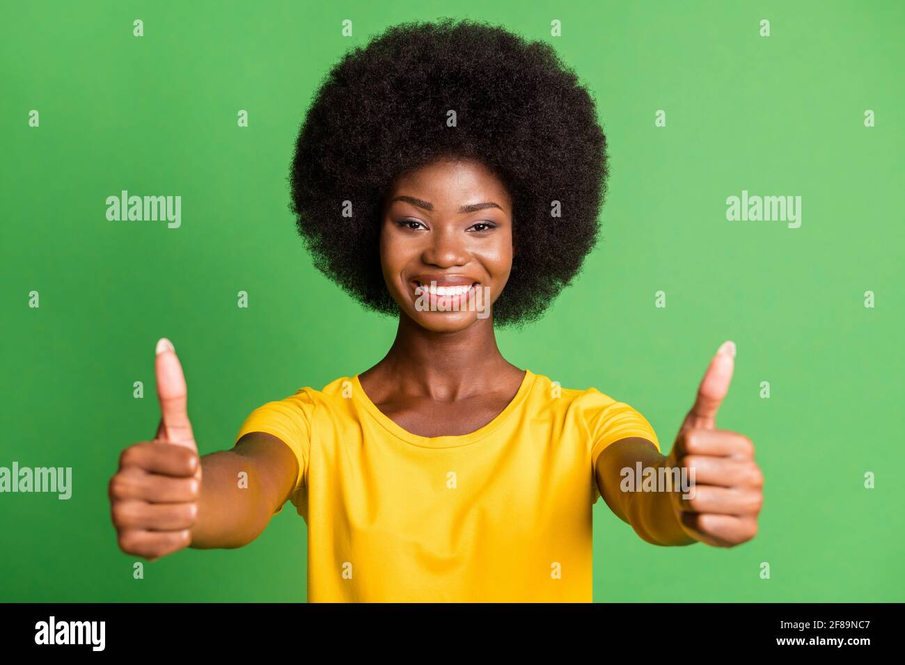 Photo of young happy cheerful positive smiling afro girl showing thumb ...