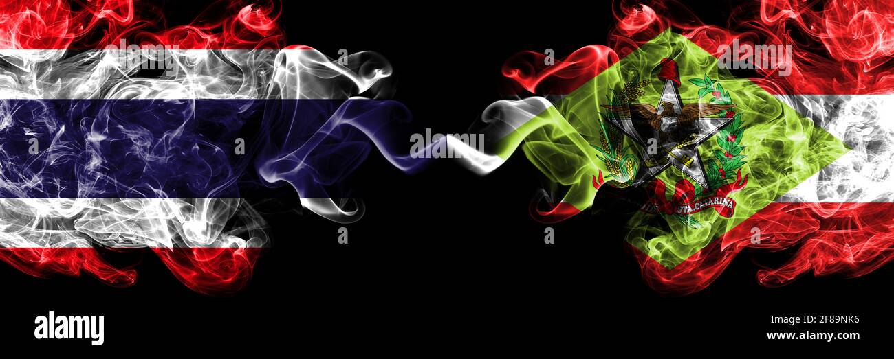 Thailand, Thai vs Brazil, Brazilian, Santa Catarina smoky mystic flags placed side by side. Thick colored silky abstract smokes flags. Stock Photo