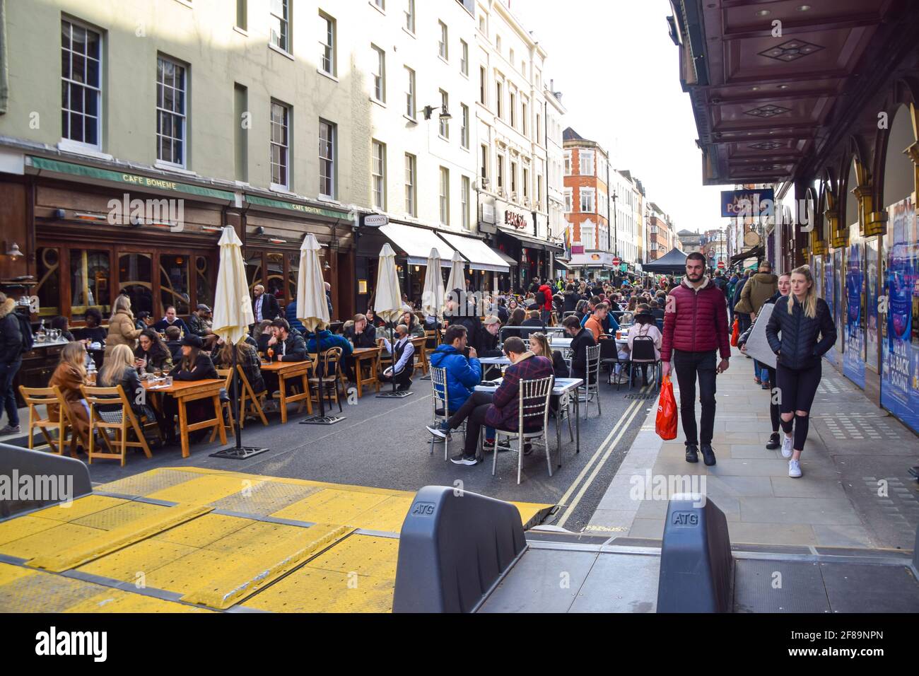 London, United Kingdom. 12th April 2021. Busy bars and restaurants in Old Compton Street, Soho. Shops, restaurants, bars and other businesses reopened today after almost four months as further lockdown rules are relaxed in England. Stock Photo