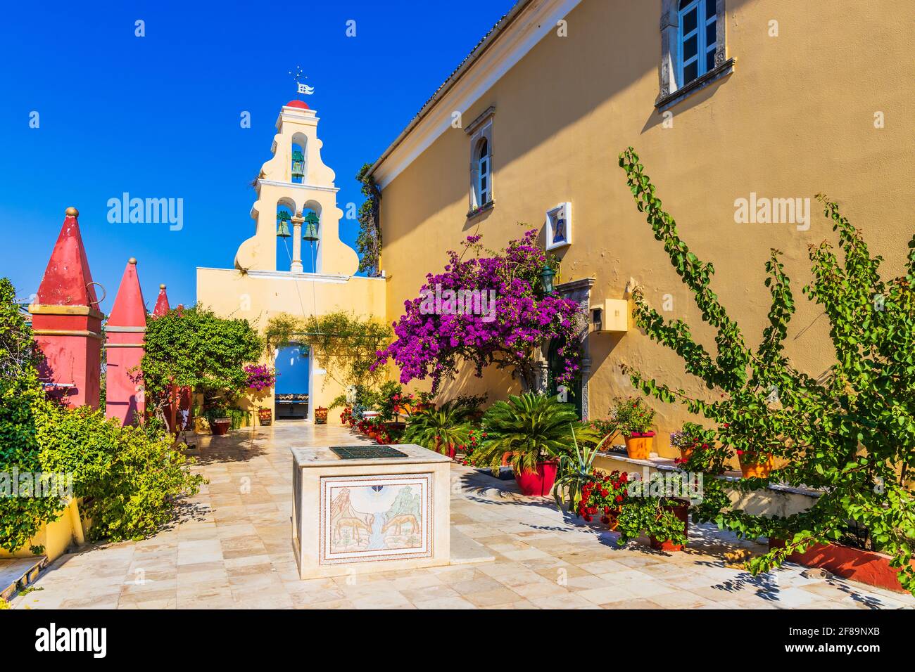 Corfu, Greece. Courtyard of the Theotokos Monastery also known as Paleokastritsa Monastery. Stock Photo