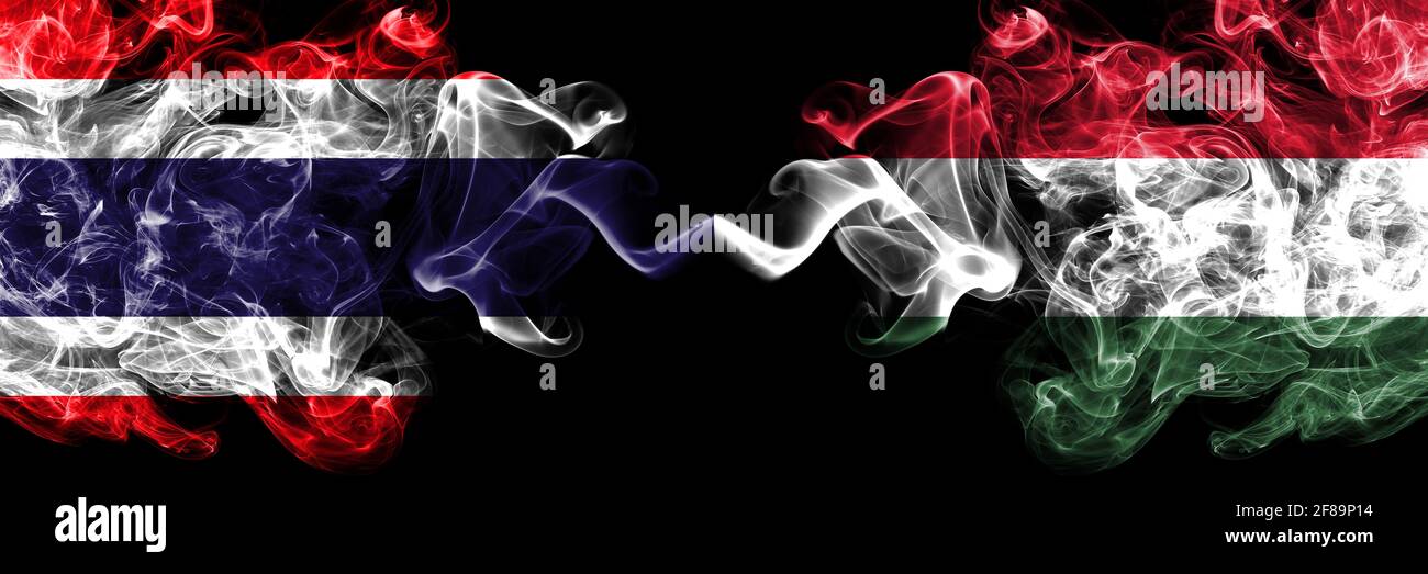 Thailand, Thai vs Hungary, Hungarian smoky mystic flags placed side by side. Thick colored silky abstract smokes flags. Stock Photo