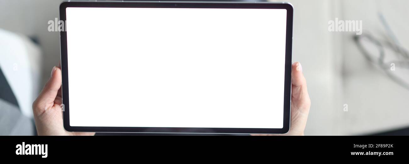 In female hands tablet with white screen Stock Photo - Alamy