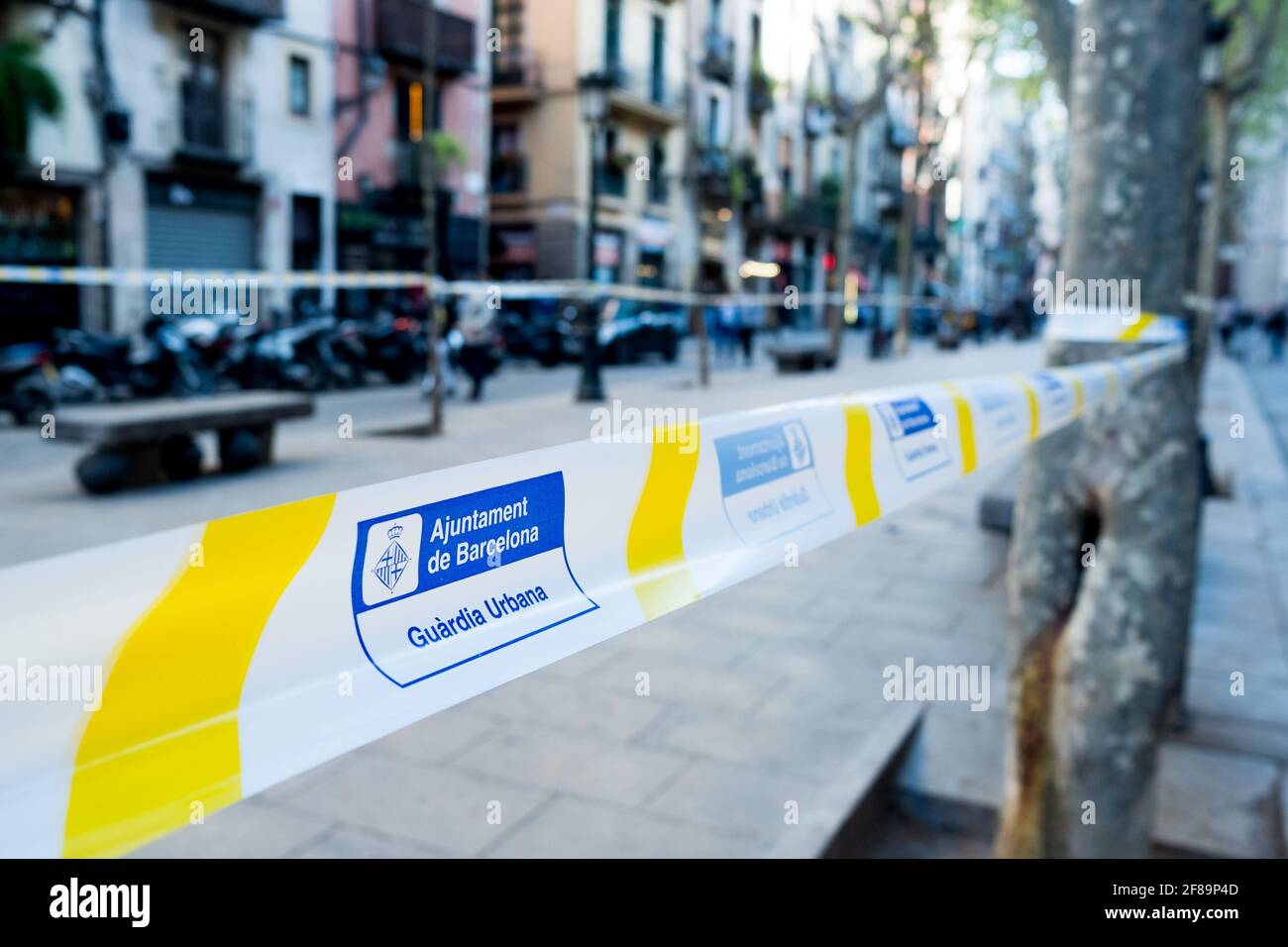 Close up of police tapes render off limits the Passeig del Born square in Barcelona, Spain on 2 April 2021, to prevent crowds of young people to gather and have street parties at night and enforce the 10.00pm curfew in place to stop the covid-19 4th wave (Photo by Davide Bonaldo/Sipa USA) Stock Photo