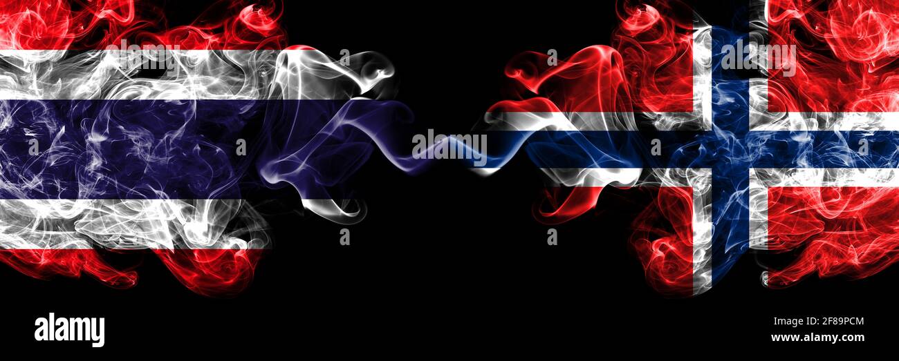Thailand, Thai vs Norway, Norwegian smoky mystic flags placed side by side. Thick colored silky abstract smokes flags. Stock Photo
