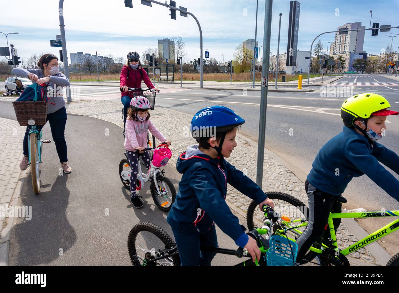 Kids adults riding bicycles hi-res stock photography and images - Alamy