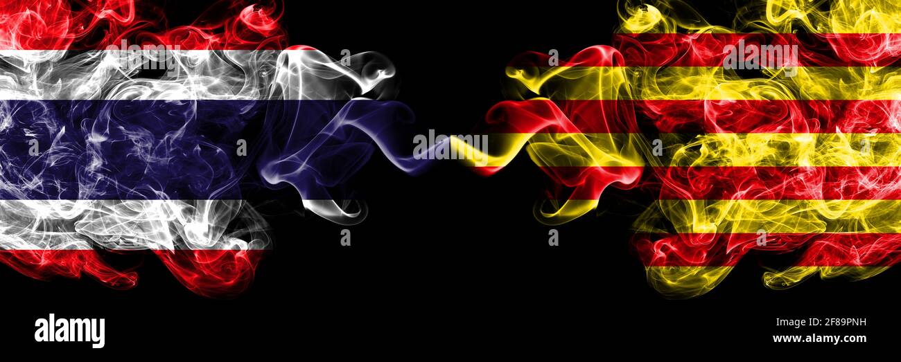 Thailand, Thai vs Spain, Spanish, Catalonia, Senyera smoky mystic flags placed side by side. Thick colored silky abstract smokes flags. Stock Photo