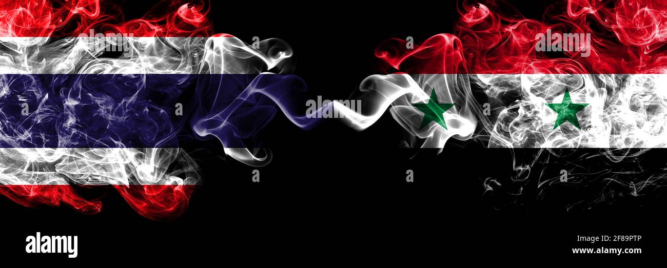 Thailand, Thai vs Syria, Syrian smoky mystic flags placed side by side. Thick colored silky abstract smokes flags. Stock Photo