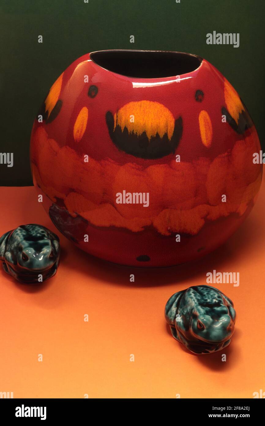 Poole pottery vase and frogs. Hand painted Poole Pottery volcano purse vase in red, gold and
