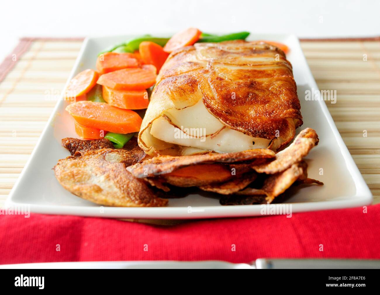 Potato wrapped halibut fish fillets hires stock photography and images