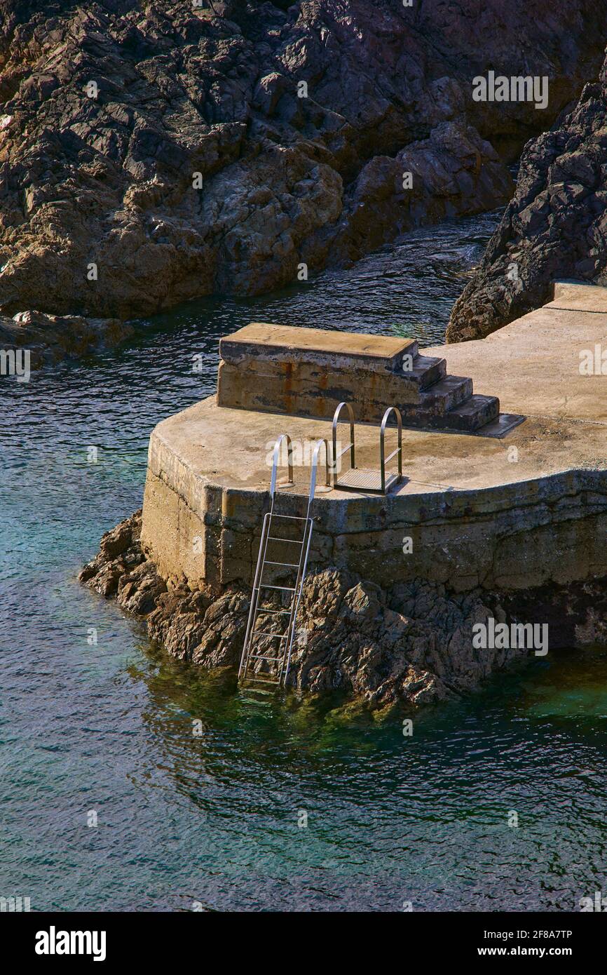 trampoline and staircase on an artificial beach directly to the ocean in Ireland Stock Photo