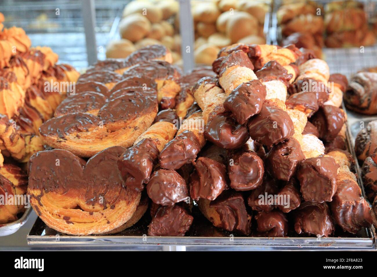 Traditional Ecuadorian pastries dipped in chocolate, Quito, Ecuador Stock Photo