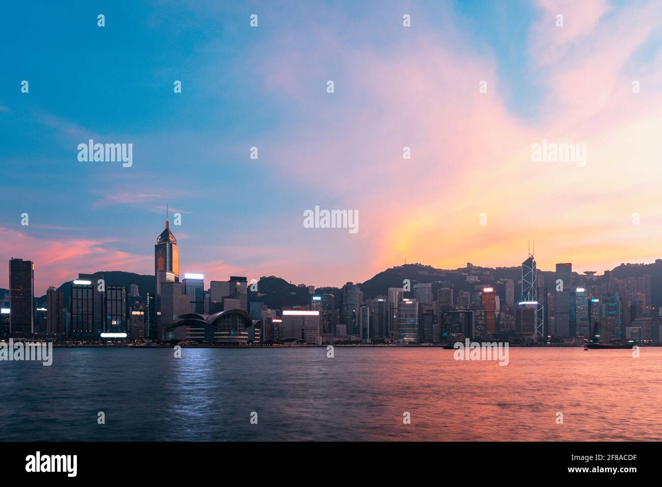 Hong Kong Victoria Harbour view with sunset Stock Photo - Alamy