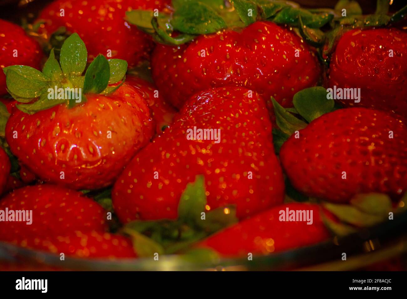 Strawberries on water and a vinegar wash Stock Photo Alamy