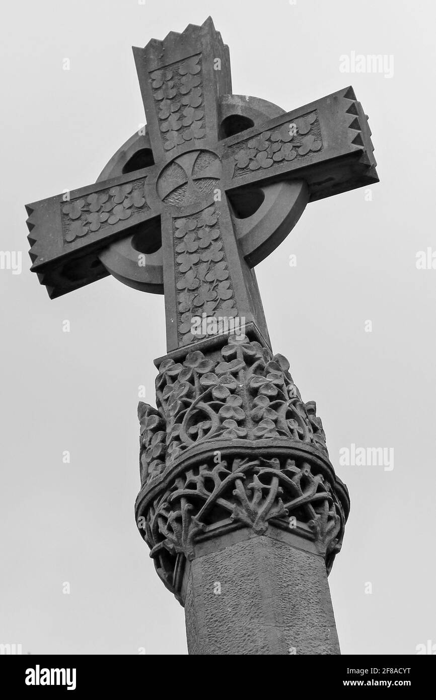 Black and White of Stone Irish Celtic Cross with Carved Shamrock Ireland Stock Photo