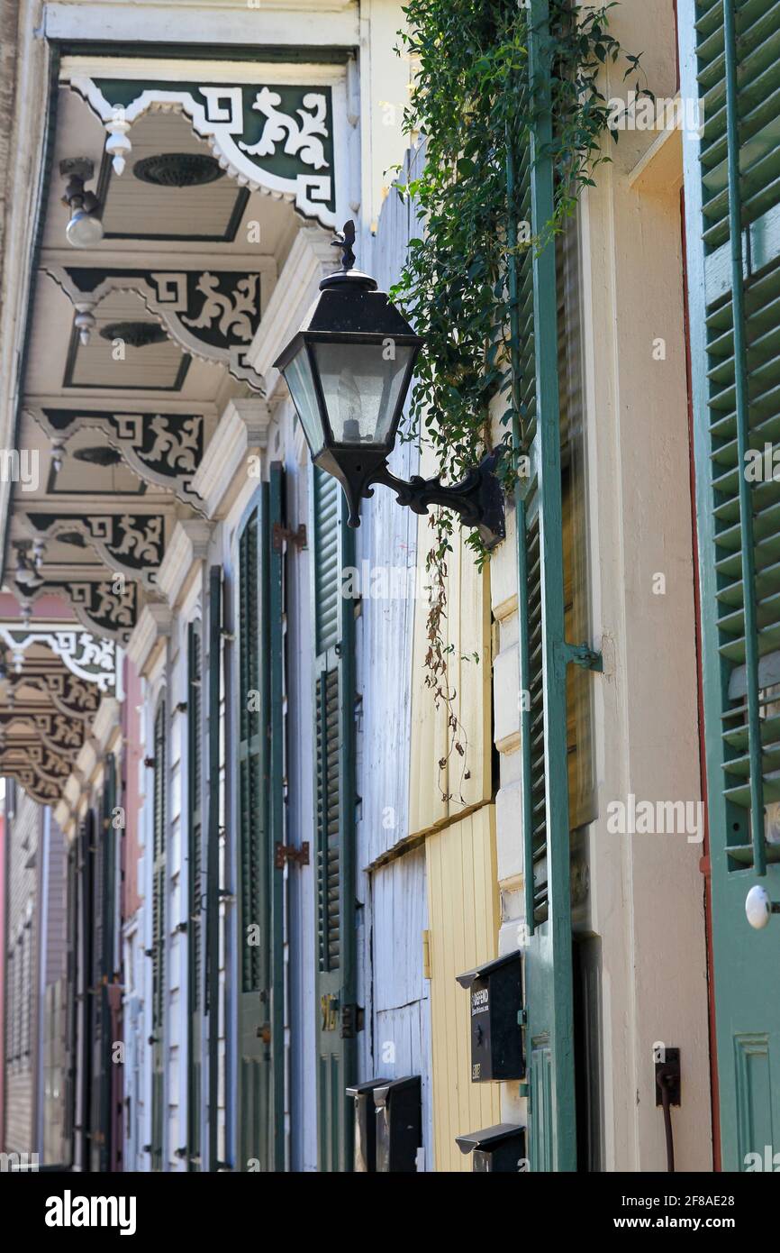 Lantern and carved decorative details of facade of New Orleans homes Stock Photo