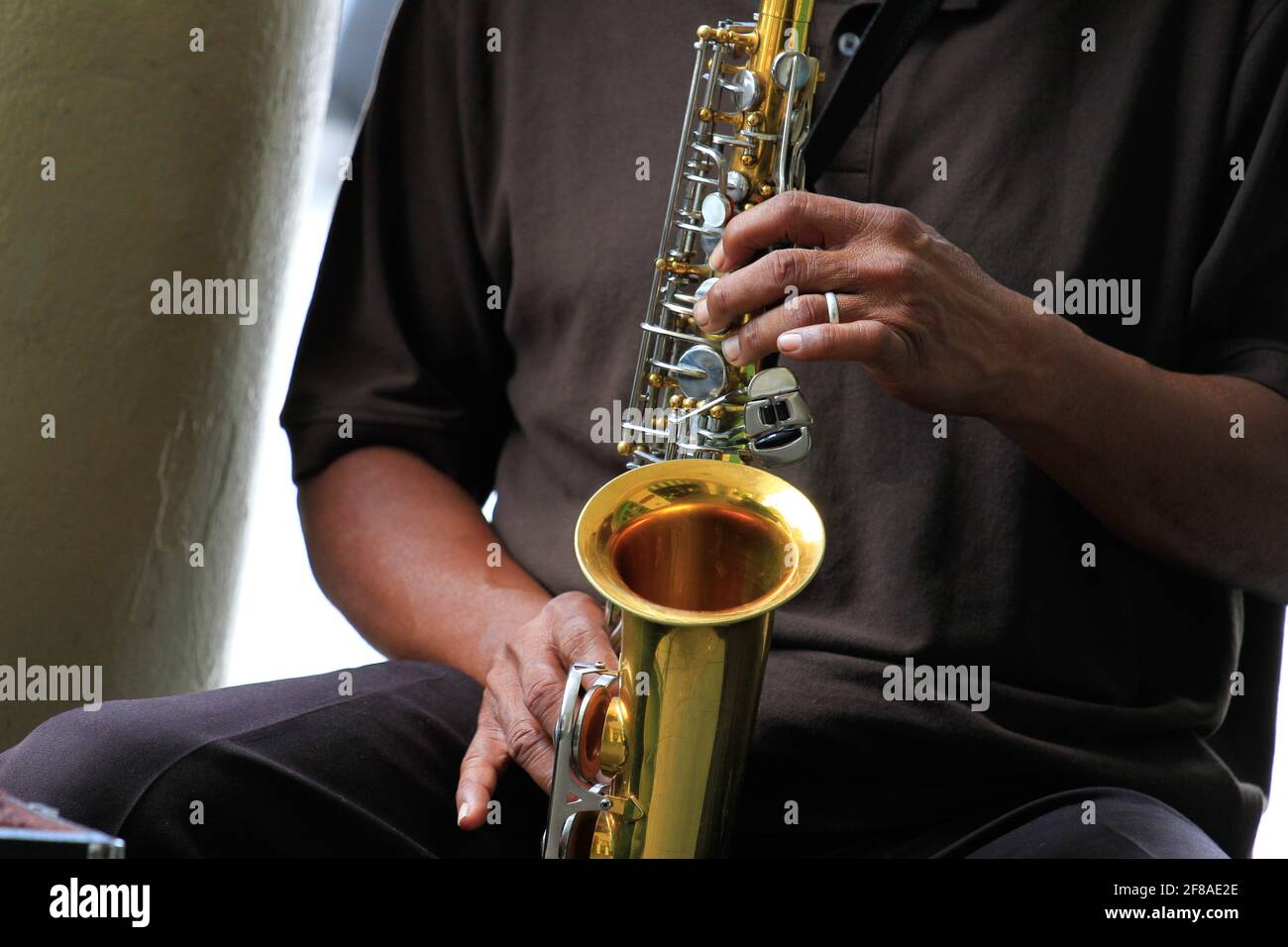 Close-up of Hands of African-American or Black Man Playing the Saxophone in New Orleans, Louisiana Stock Photo