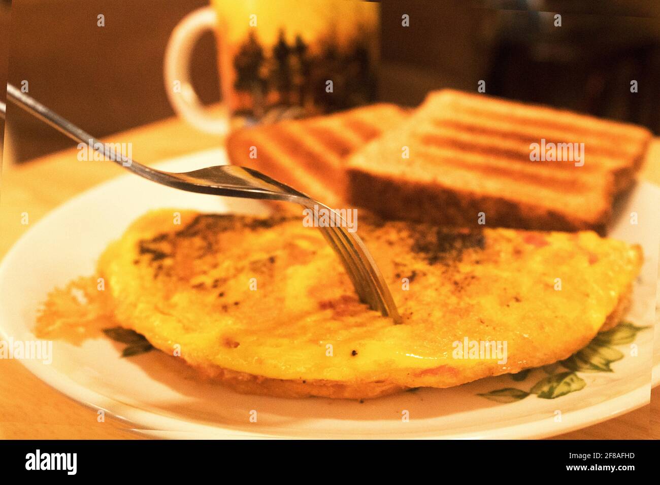 breakfast of an omelet with two breads and a cup of coffee Stock Photo