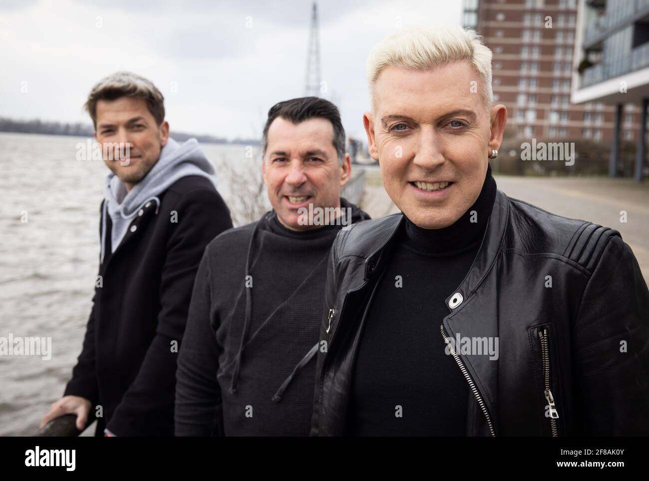 Hamburg, Germany. 09th Apr, 2021. H.P. Baxxter (r), frontman and singer of  the band Scooter, and his band members Sebastian Schilde (l) and Michael  Simon at a photo session after an interview