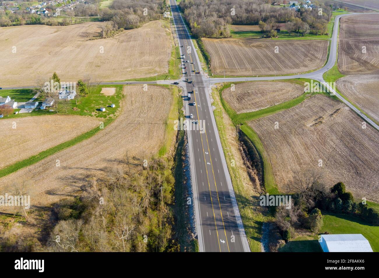 View of an country asphalt road through agricultural fields, in the Caseyville Illinois on USA Stock Photo