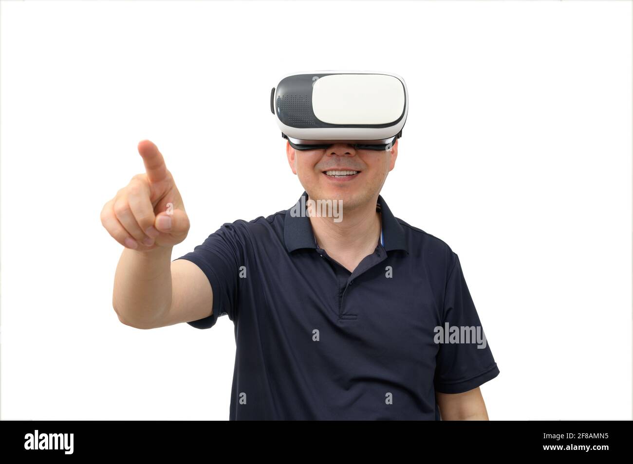 Man wearing virtual reality goggles. Studio shot, white background. Stock Photo